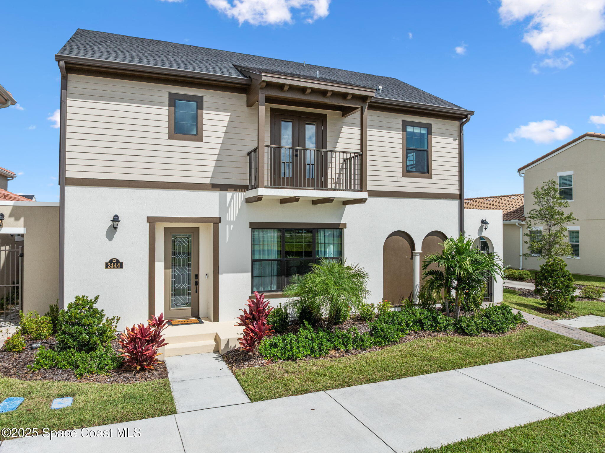 2444 Addison Drive Melbourne, FL 32940 - Photo 1 of 93 a front view of a house with garden