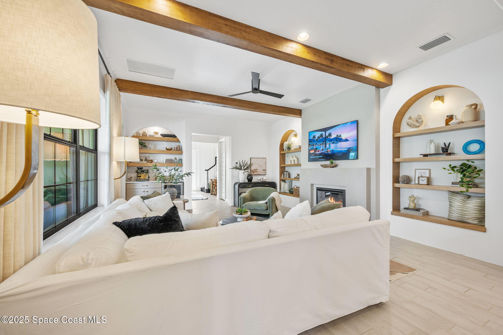 2444 Addison Drive Melbourne, FL 32940 - Photo 11 of 93 a living room with furniture and a large window
