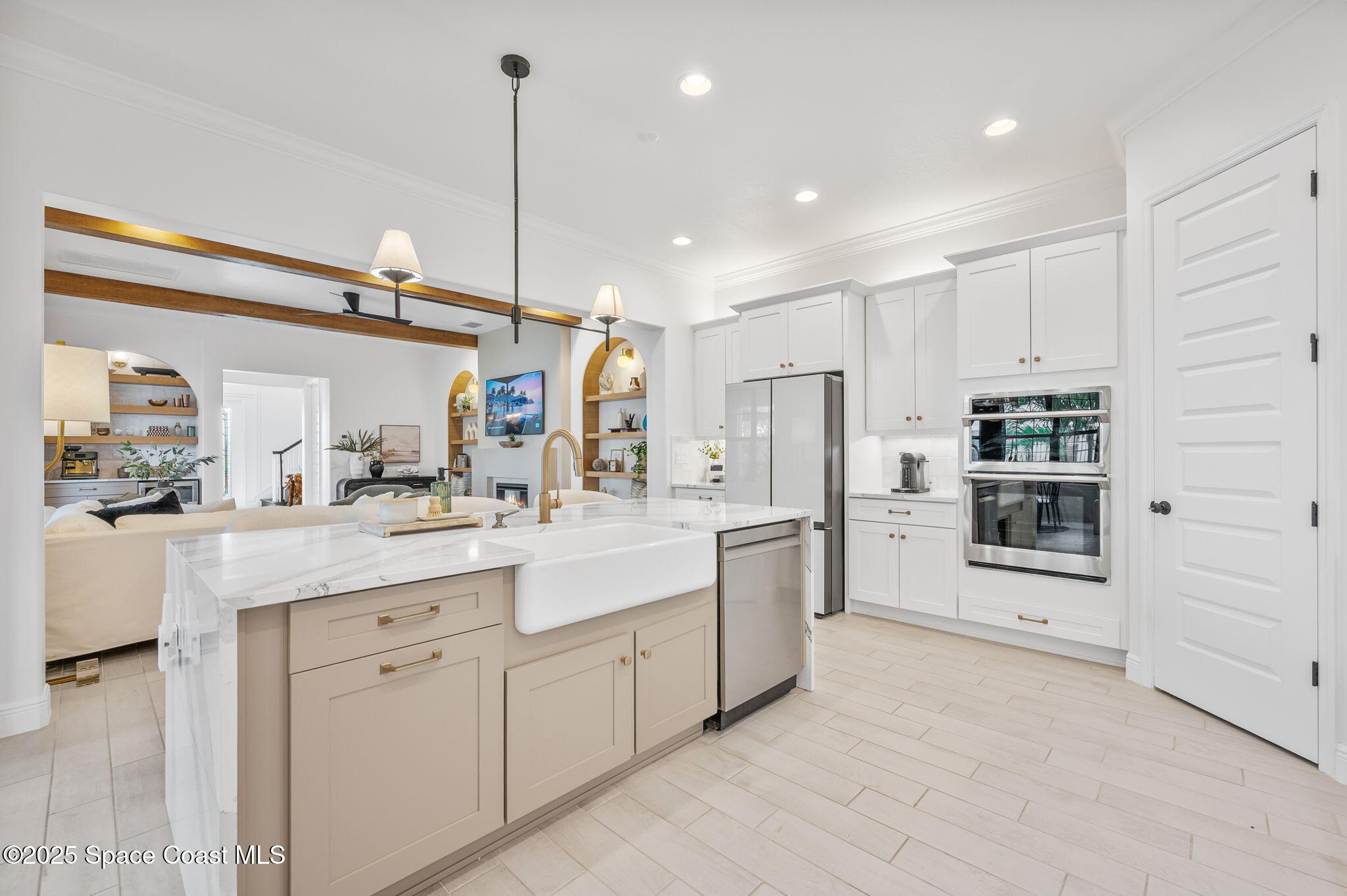 2444 Addison Drive Melbourne, FL 32940 - Photo 16 of 93 a kitchen with kitchen island white cabinets and stainless steel appliances