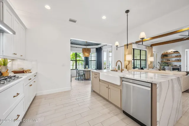 a living room with furniture large window and flat screen tv