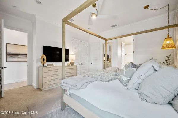 an aerial view of a pool yard tennis courts and ocean view