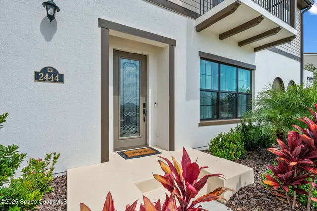 a bed sitting in front of a house