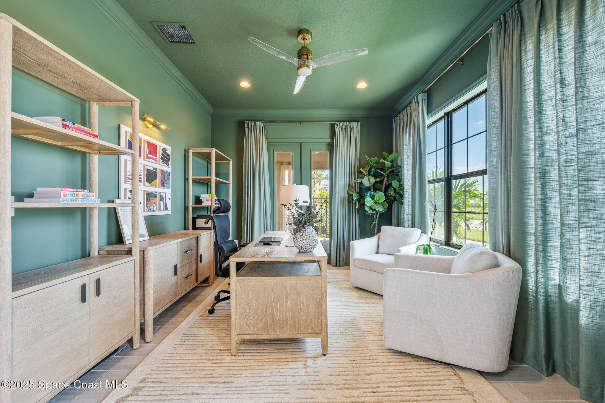 2444 Addison Drive Melbourne, FL 32940 - Photo 32 of 93 a living room with furniture large window and flat screen tv