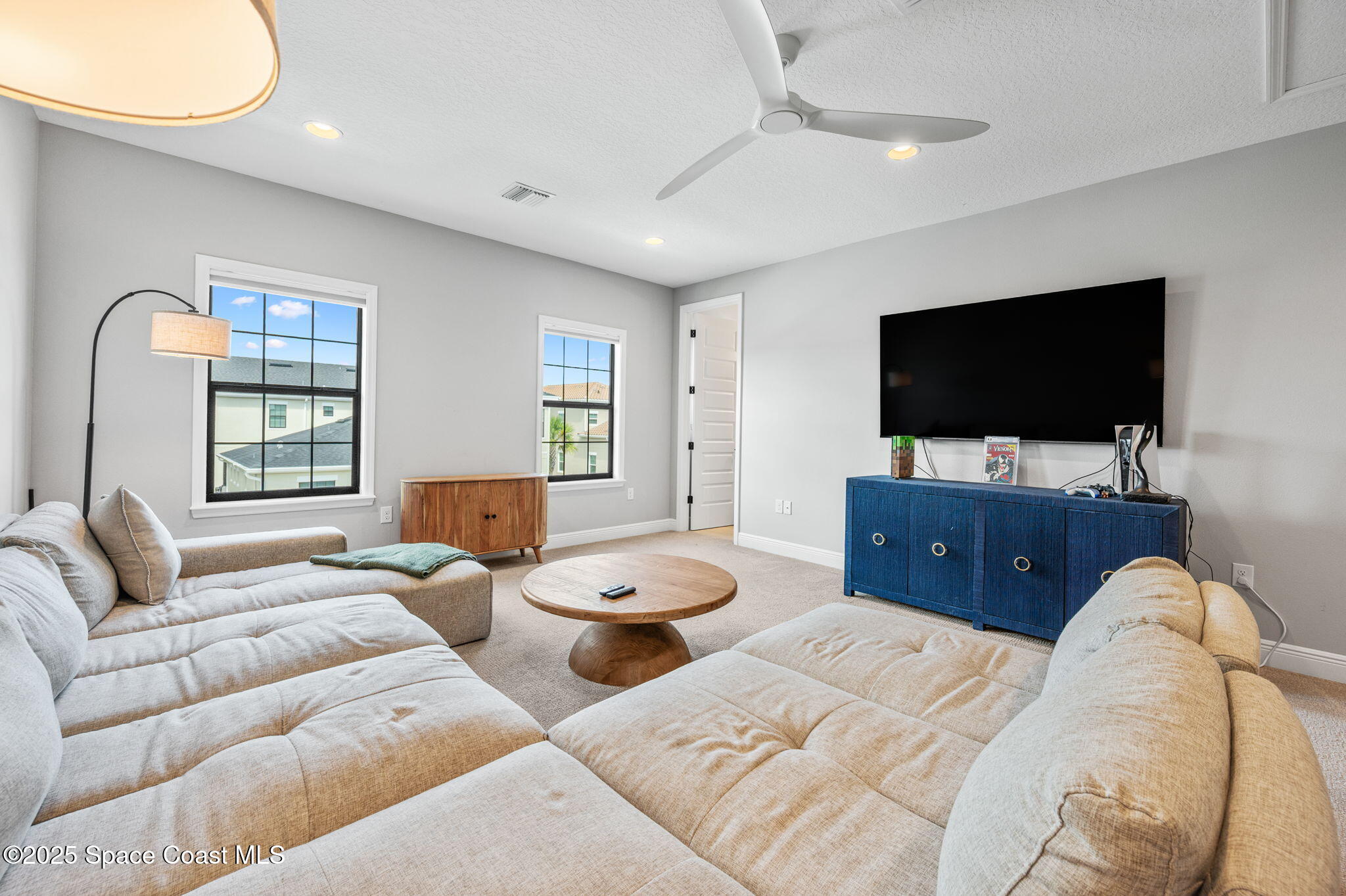 2444 Addison Drive Melbourne, FL 32940 - Photo 45 of 93 a living room with furniture and a flat screen tv