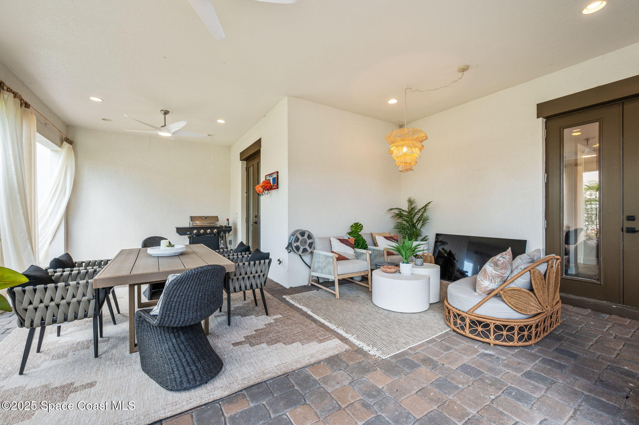 2444 Addison Drive Melbourne, FL 32940 - Photo 51 of 93 a living room with furniture a window and a potted plant