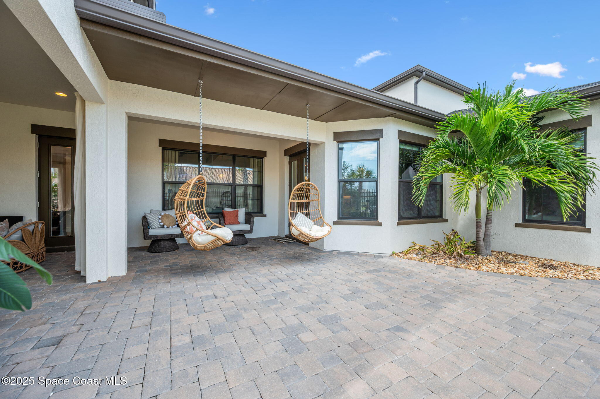 2444 Addison Drive Melbourne, FL 32940 - Photo 54 of 93 a view of a house with backyard porch and sitting area