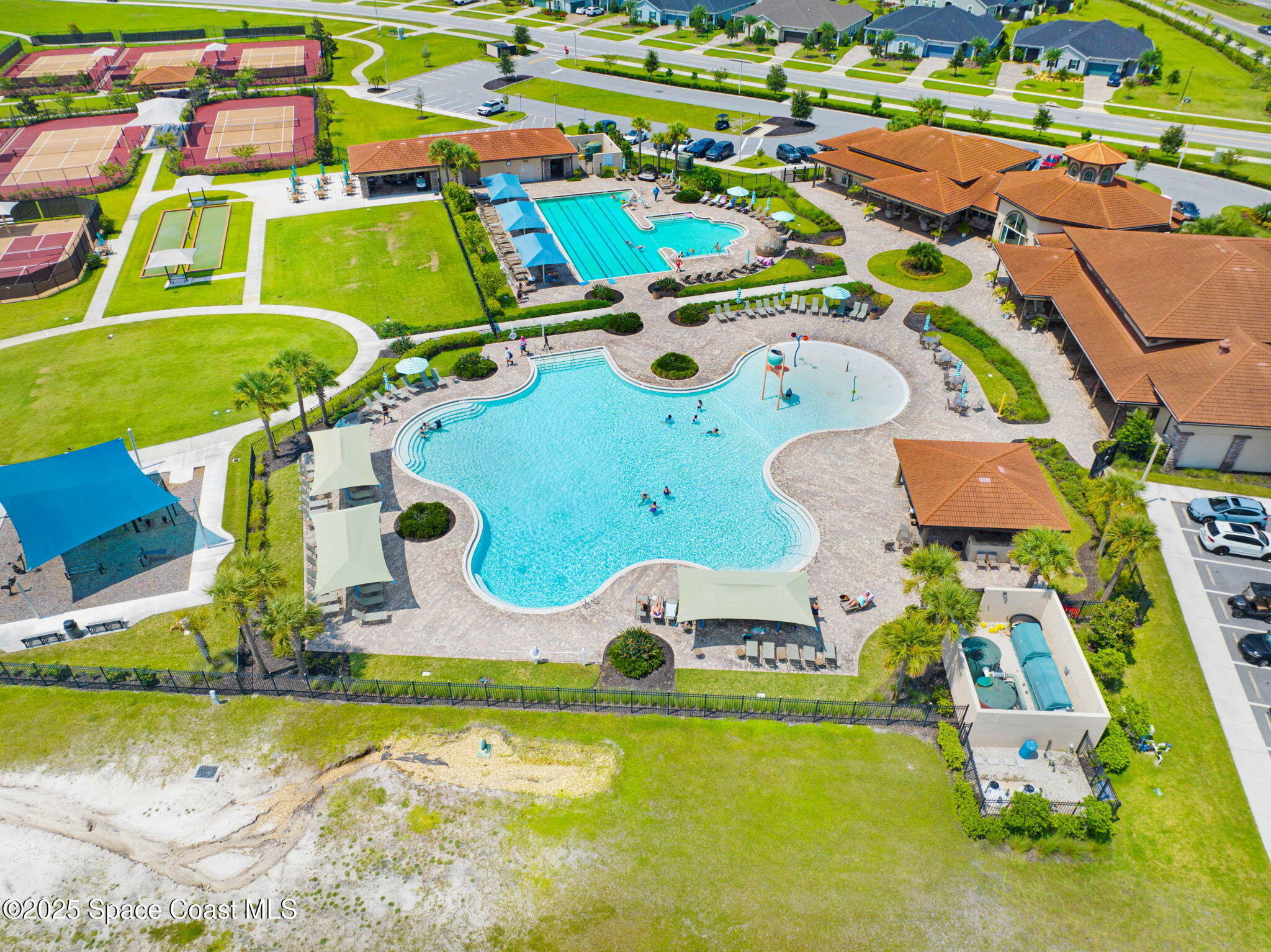 2444 Addison Drive Melbourne, FL 32940 - Photo 66 of 93 an aerial view of a pool patio chairs and fire pit