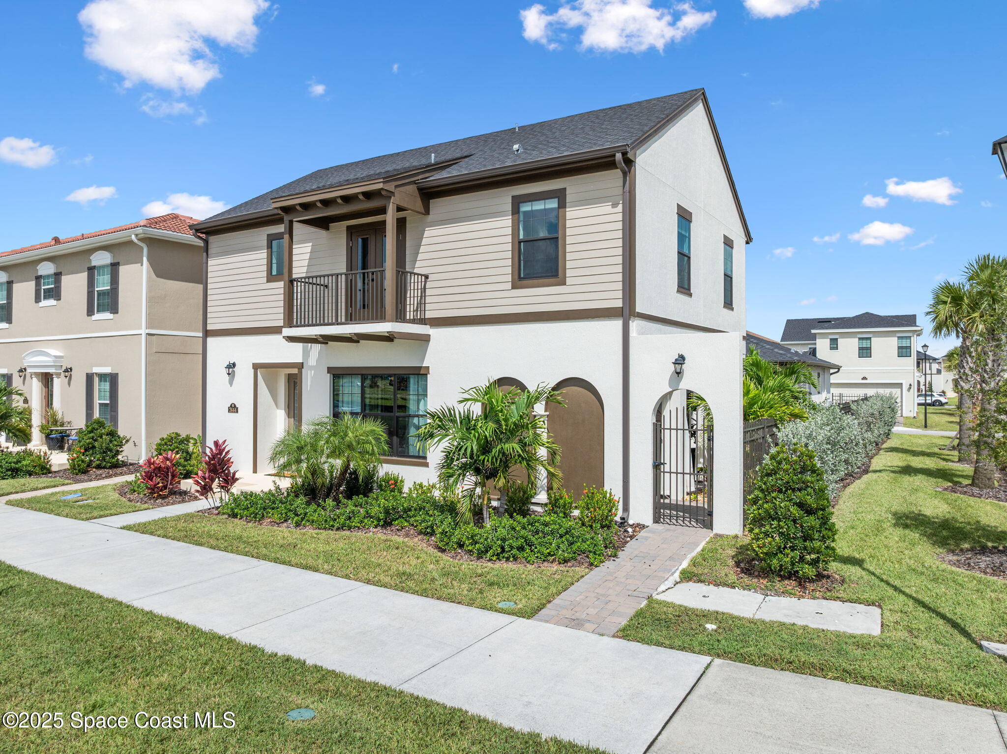 2444 Addison Drive Melbourne, FL 32940 - Photo 74 of 93 a front view of a house with a garden