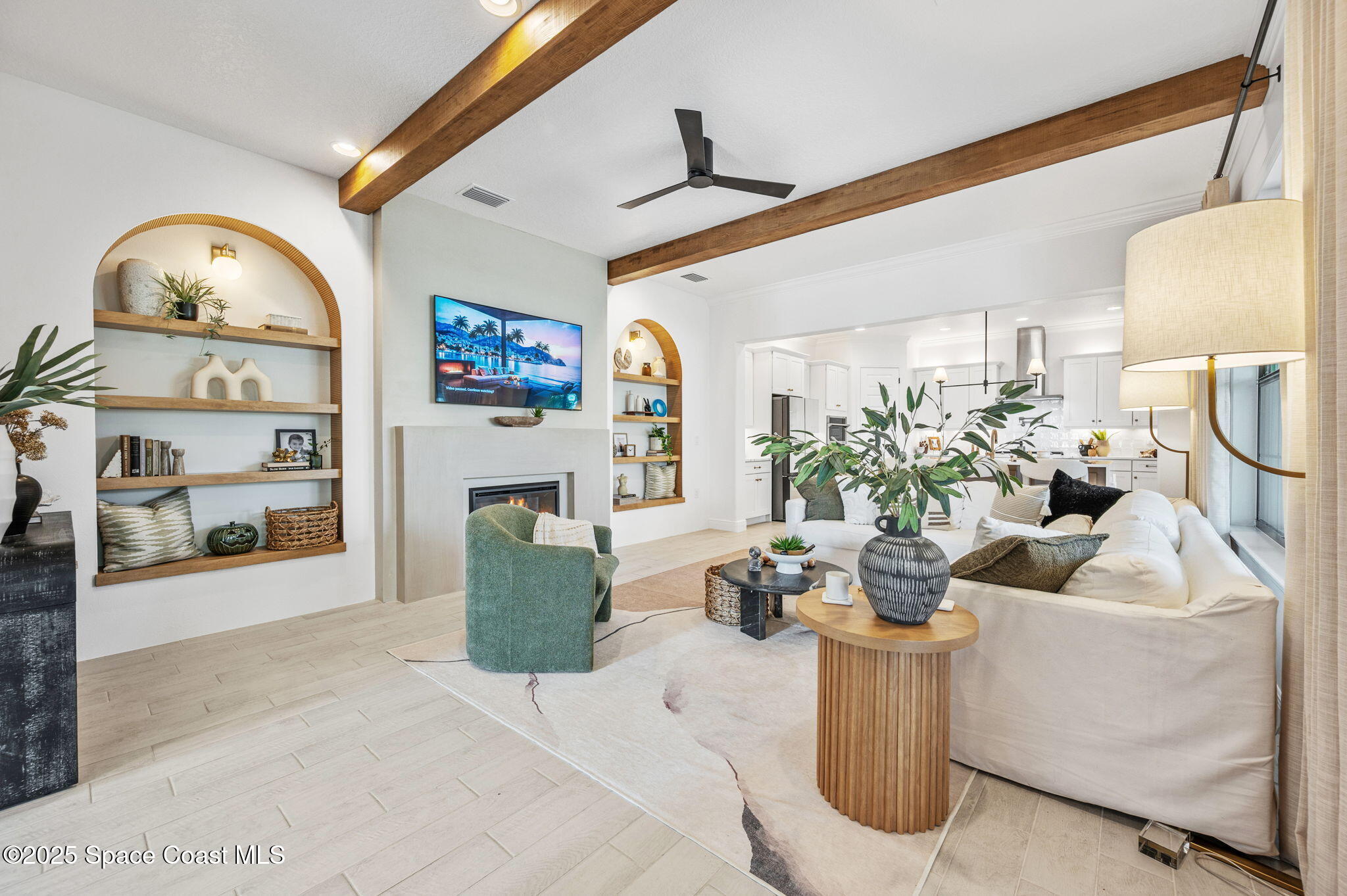 2444 Addison Drive Melbourne, FL 32940 - Photo 8 of 93 a living room with furniture a fireplace and a flat screen tv
