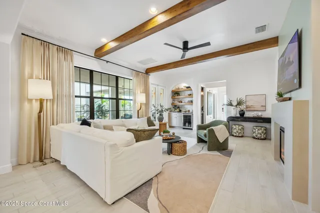 a kitchen with kitchen island white cabinets and stainless steel appliances