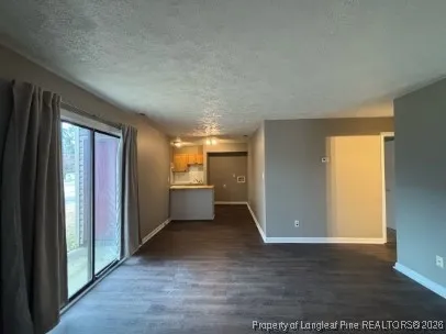 a view of a hallway with a kitchen