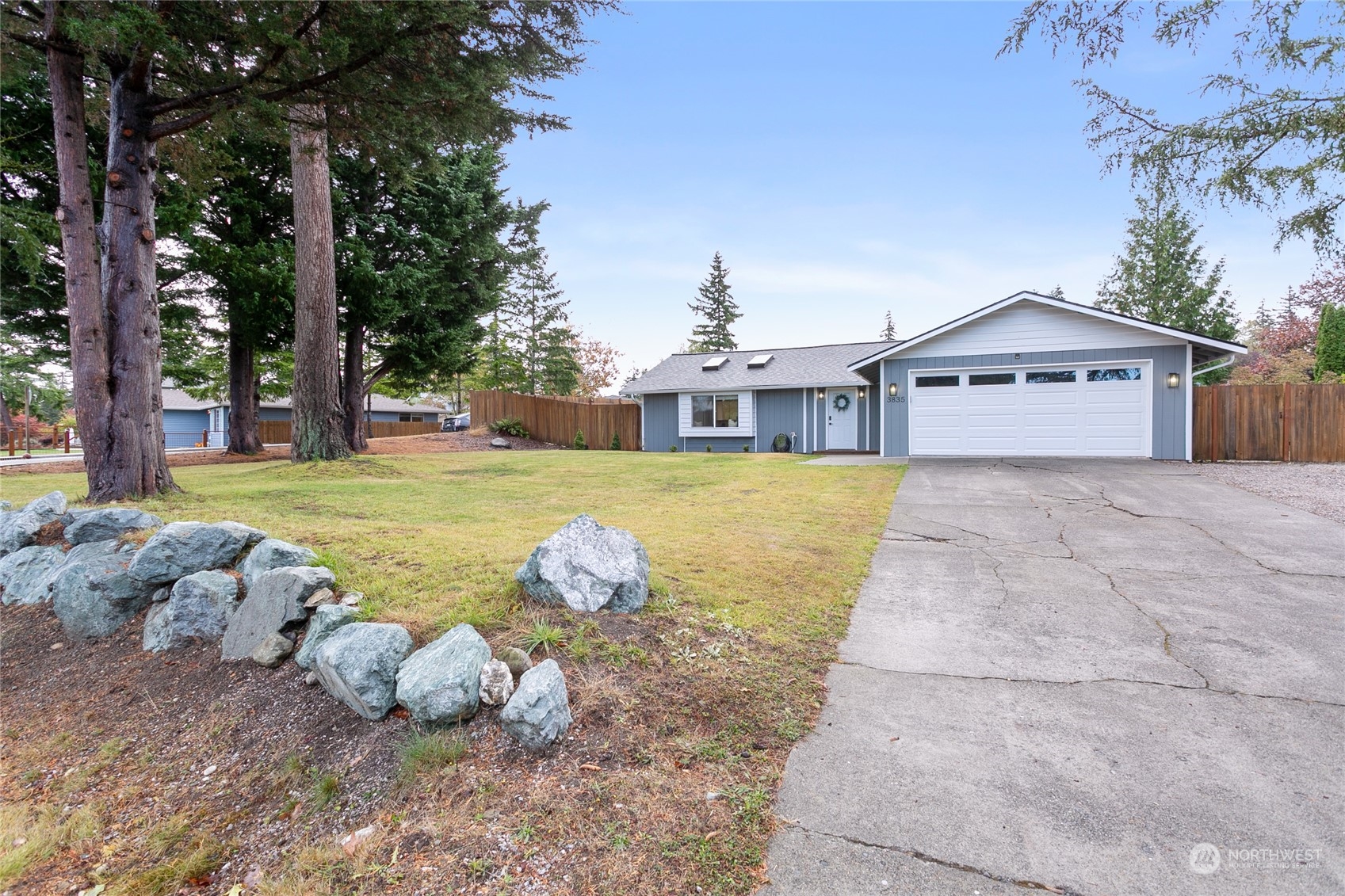 3835 Spring Coulee Road Bellingham, WA 98226 - Photo 1 of 30 a view of a house with a yard and sitting area