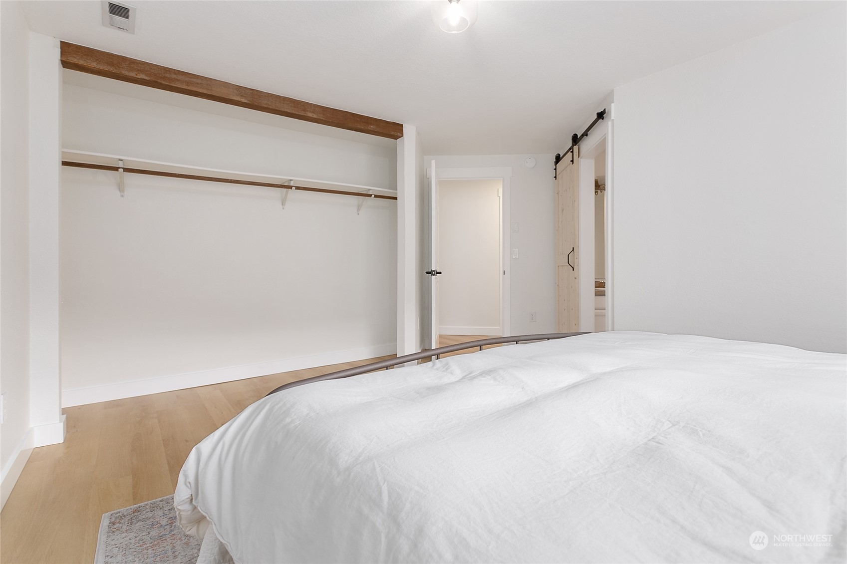 3835 Spring Coulee Road Bellingham, WA 98226 - Photo 13 of 30 a bedroom with a bed and a refrigerator
