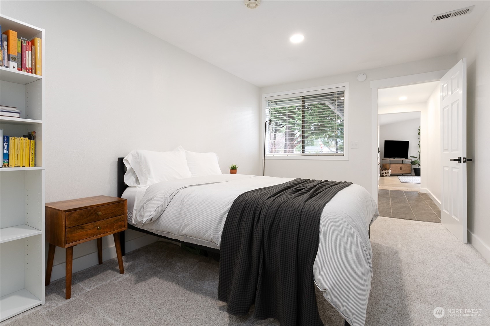 3835 Spring Coulee Road Bellingham, WA 98226 - Photo 20 of 30 a bedroom with a bed and a potted plant next to a window