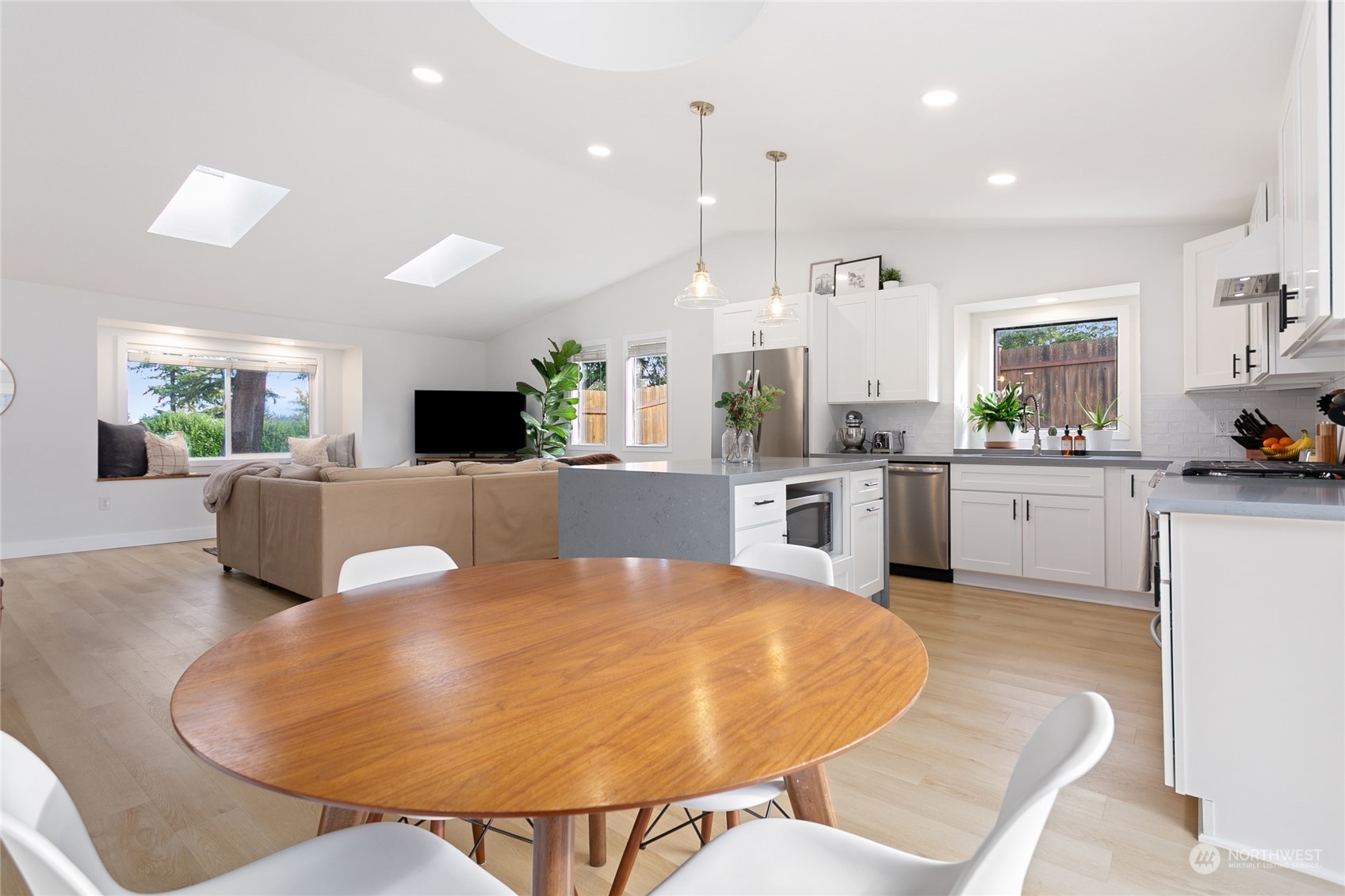 3835 Spring Coulee Road Bellingham, WA 98226 - Photo 3 of 30 a large kitchen with a table chairs and a refrigerator