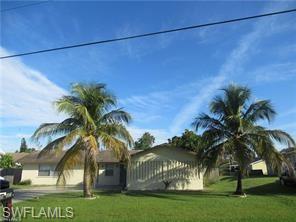 7461 Pebble Beach Road Fort Myers, FL 33967 - Photo 1 of 11 a view of a palm trees front of house
