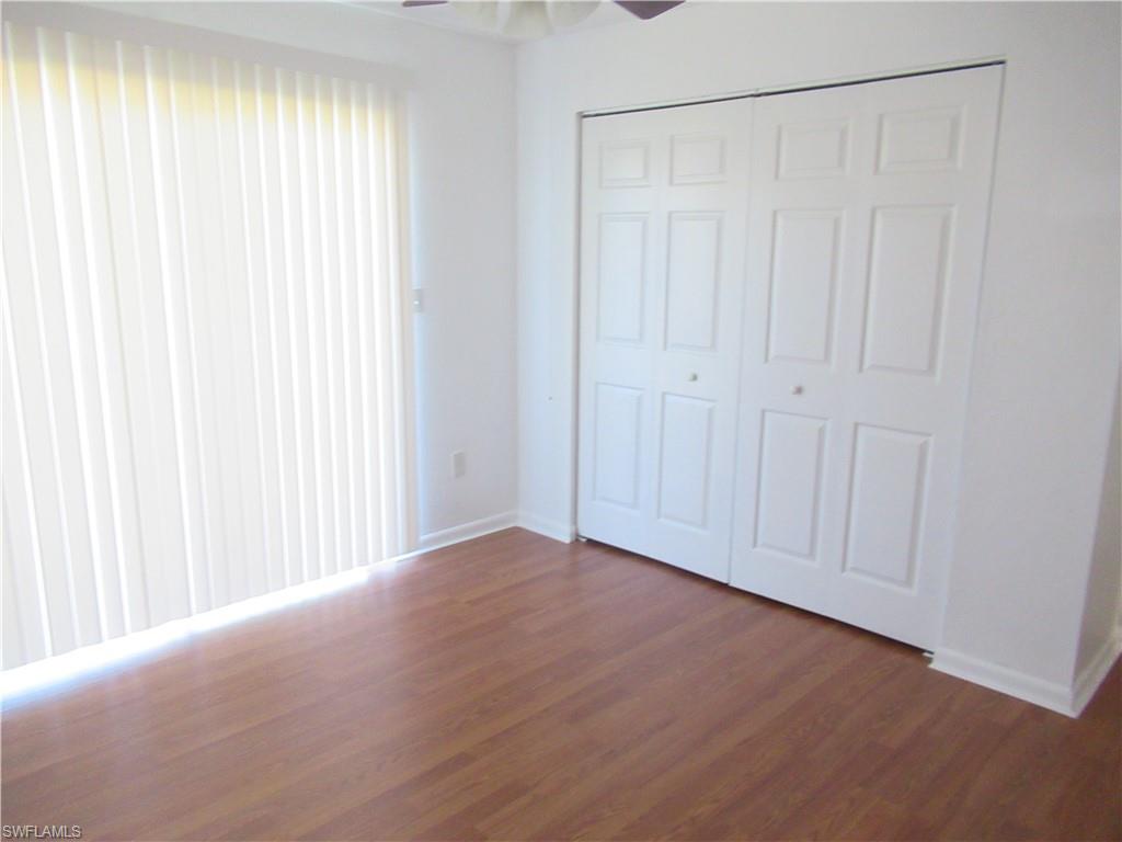 7461 Pebble Beach Road Fort Myers, FL 33967 - Photo 8 of 11 a view of a room with a wooden floor and a window