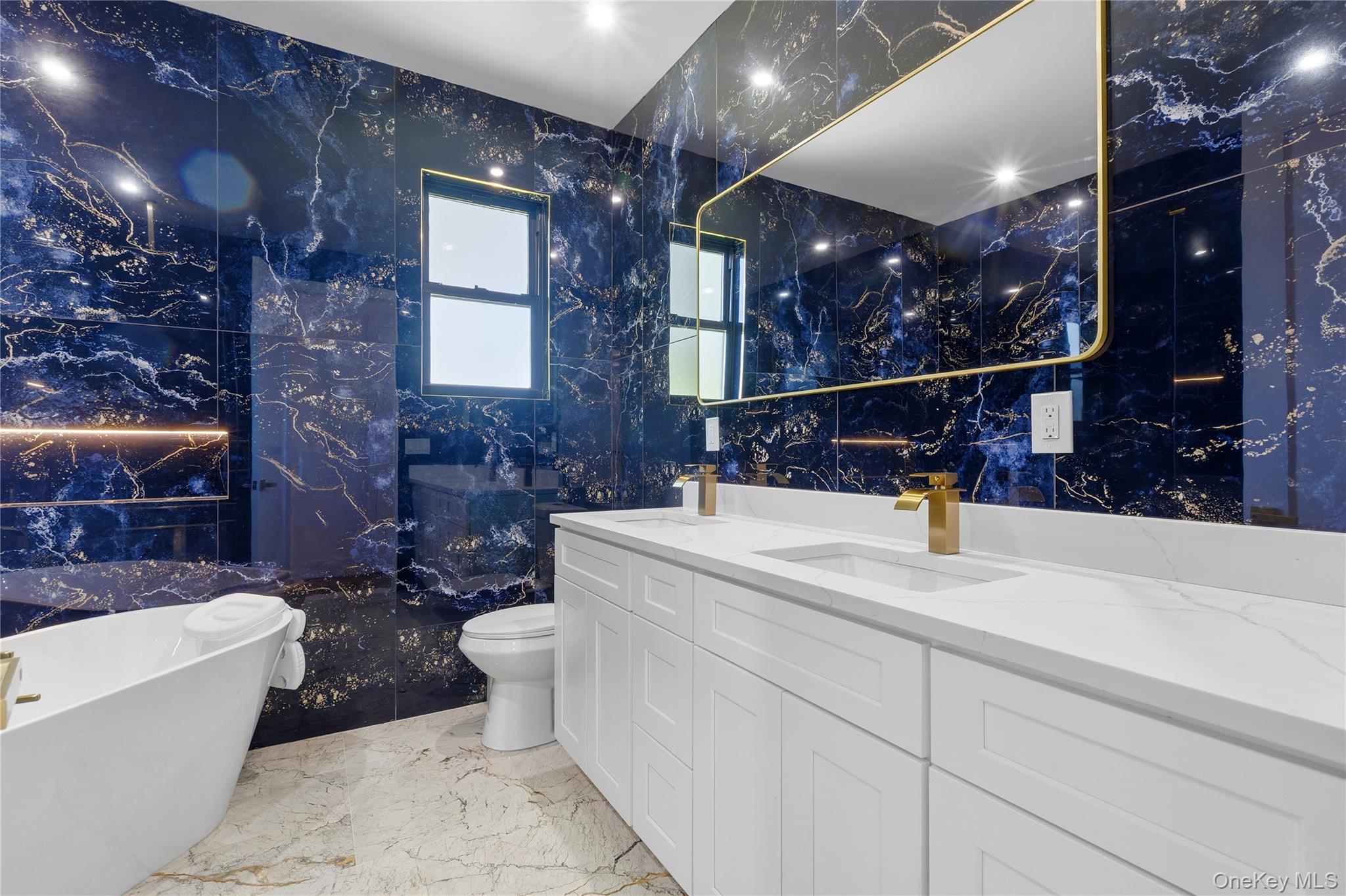 548 Lakes Road Monroe, NY 10950 - Photo 46 of 50 a bathroom with a sink a toilet and shower