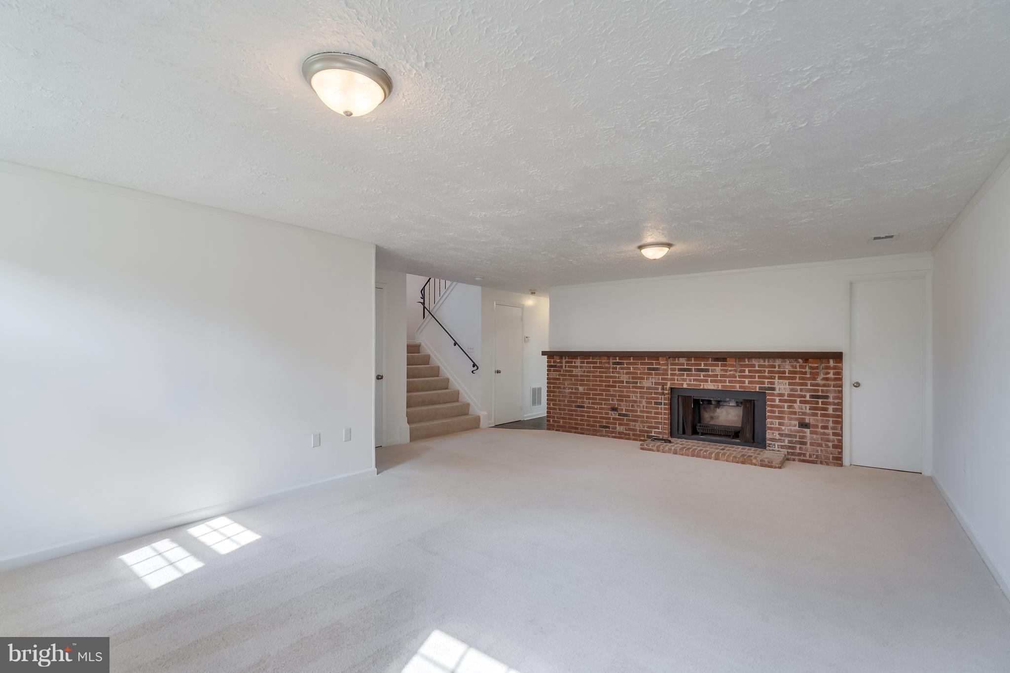 9533 Burning Branch Road Burke, VA 22015 - Photo 21 of 29 Basement w/wood burning fpl
