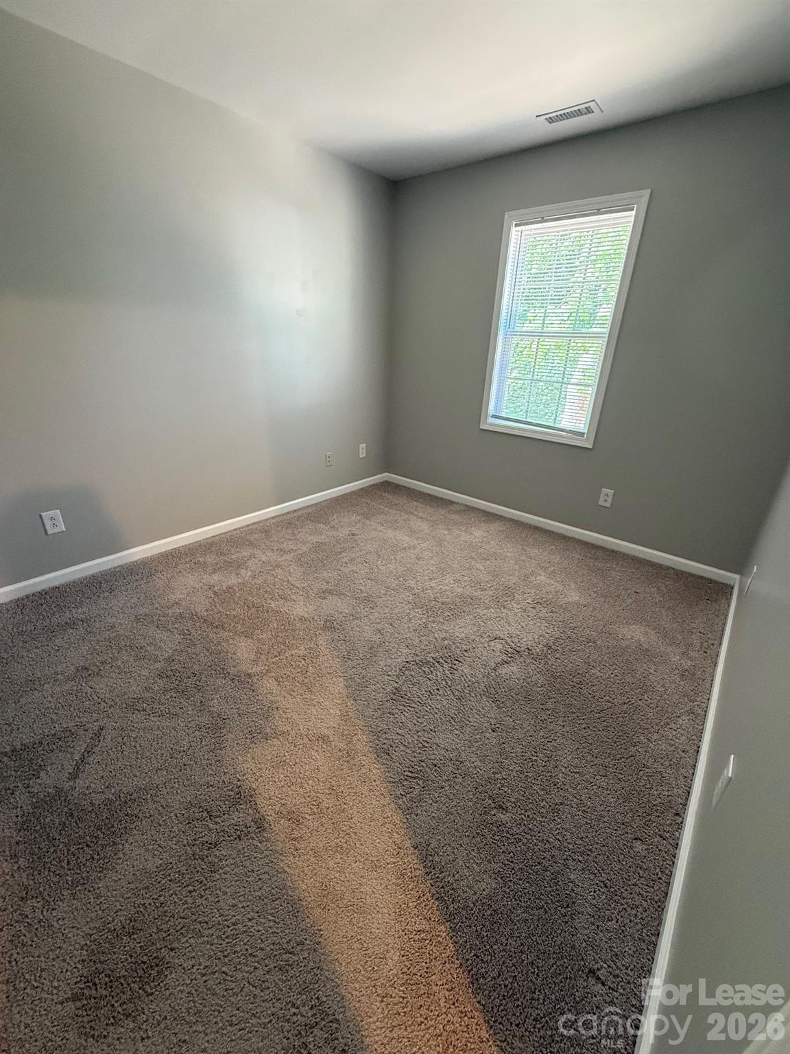 1009 22nd Street Northeast Hickory, NC 28601 - Photo 5 of 8 an empty room with a window