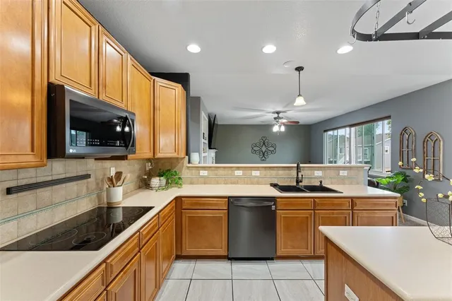 a view of hallway with wooden floor and stairs