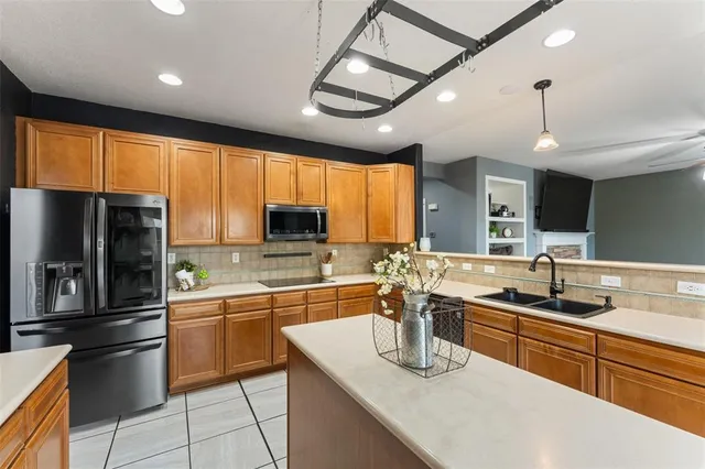 a bathroom with a bathtub a sink a mirror and a window