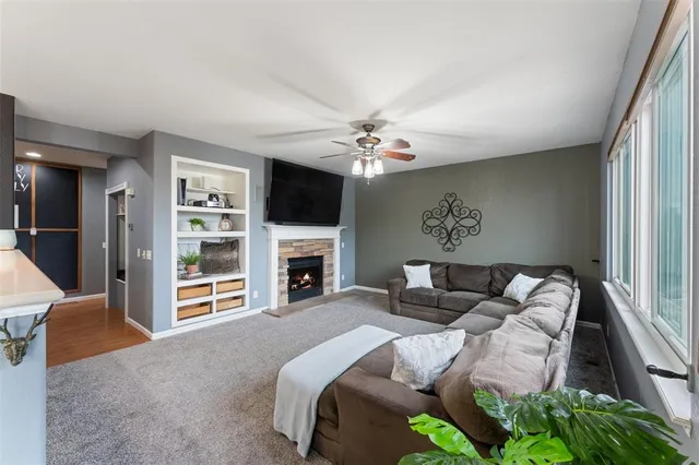 a view of a hallway view with wooden floor and staircase