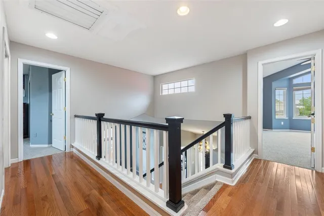 a view of backyard with a deck and wooden floor