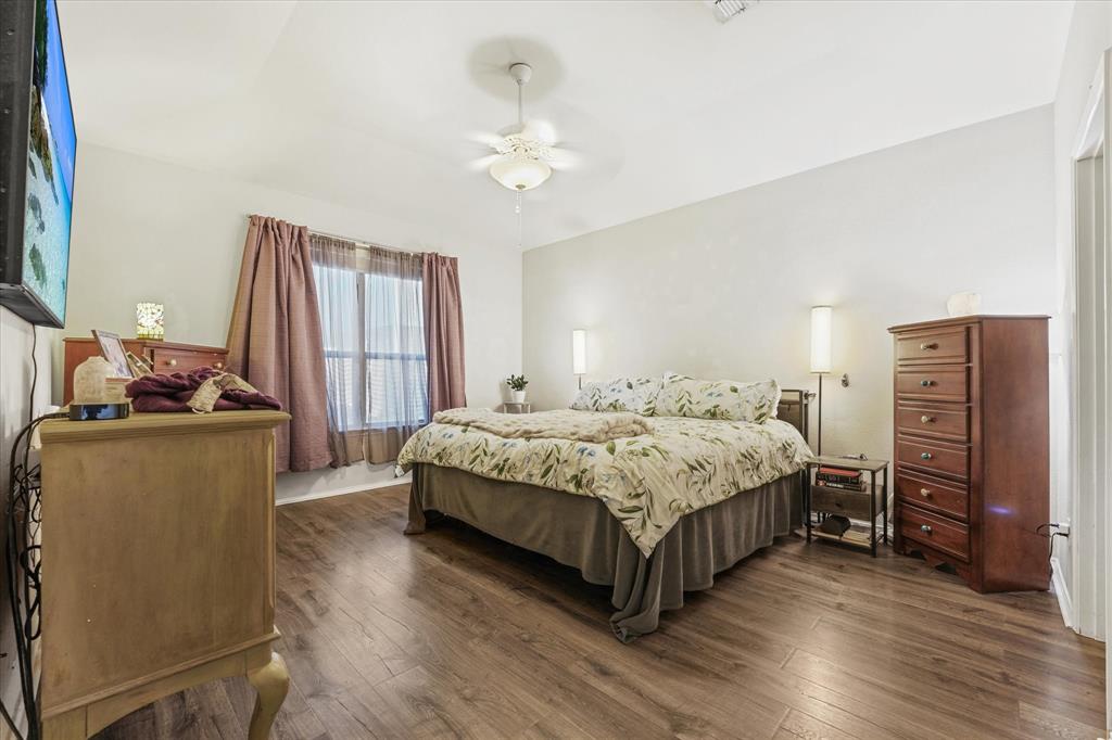 3801 Surf Street Denton, TX 76208 - Photo 18 of 29 Bedroom with dark wood-style floors and a ceiling fan