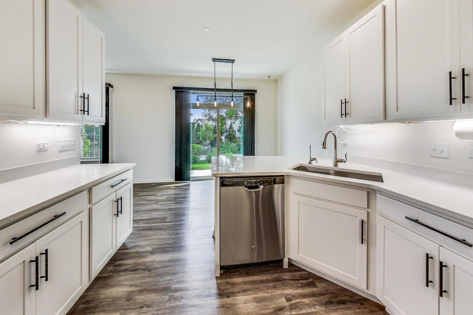 1663 Kraft Avenue Batavia, IL 60510 - Photo 14 of 47 a kitchen with a sink stove and cabinets