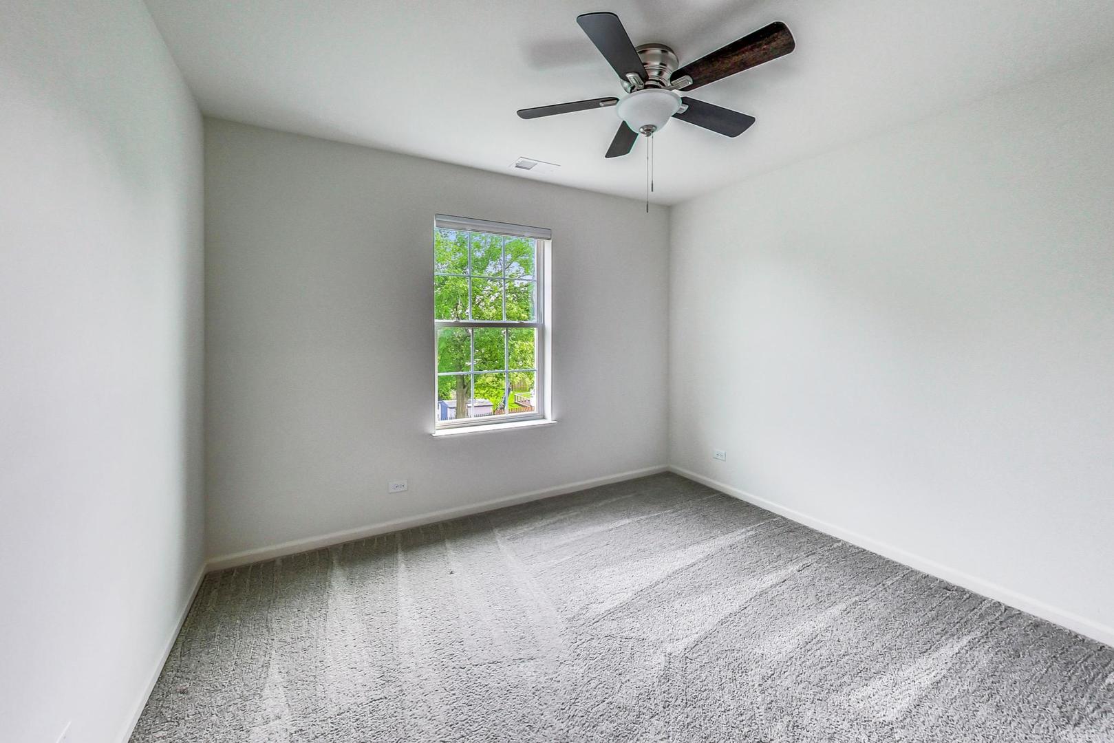1663 Kraft Avenue Batavia, IL 60510 - Photo 25 of 47 an empty room with a window and a fan