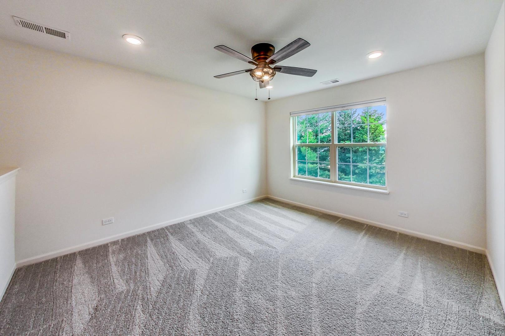 1663 Kraft Avenue Batavia, IL 60510 - Photo 29 of 47 an empty room with windows and fan