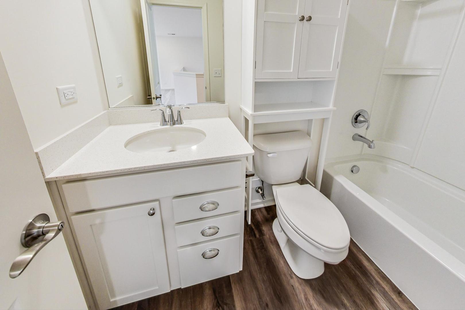 1663 Kraft Avenue Batavia, IL 60510 - Photo 30 of 47 a bathroom with a sink toilet and shower