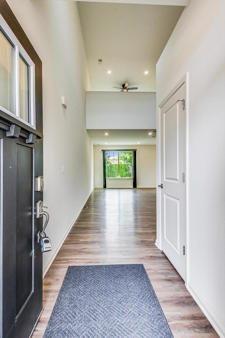 1663 Kraft Avenue Batavia, IL 60510 - Photo 4 of 47 wooden floor in an empty room with a window