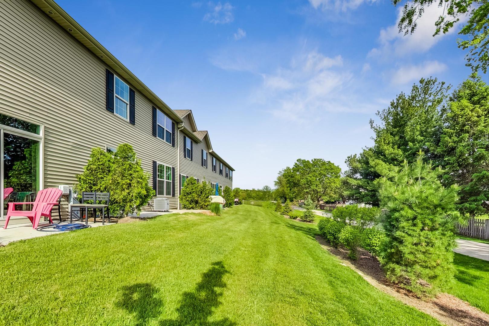 1663 Kraft Avenue Batavia, IL 60510 - Photo 42 of 47 a backyard of a house with yard and outdoor seating