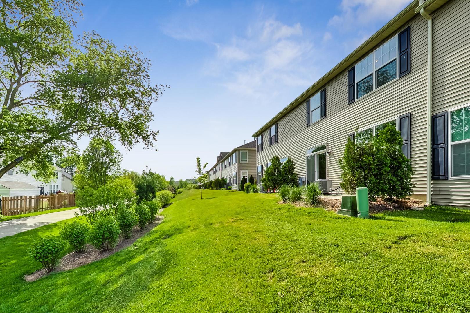1663 Kraft Avenue Batavia, IL 60510 - Photo 44 of 47 a view of a big house with a big yard and plants