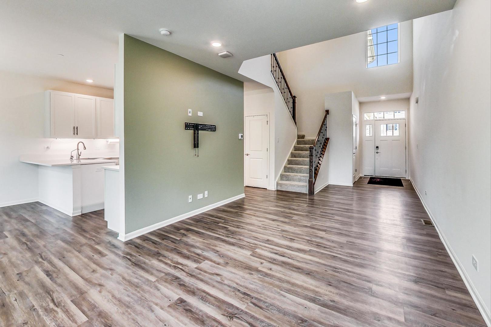 1663 Kraft Avenue Batavia, IL 60510 - Photo 7 of 47 a view of a room with wooden floor and stairs