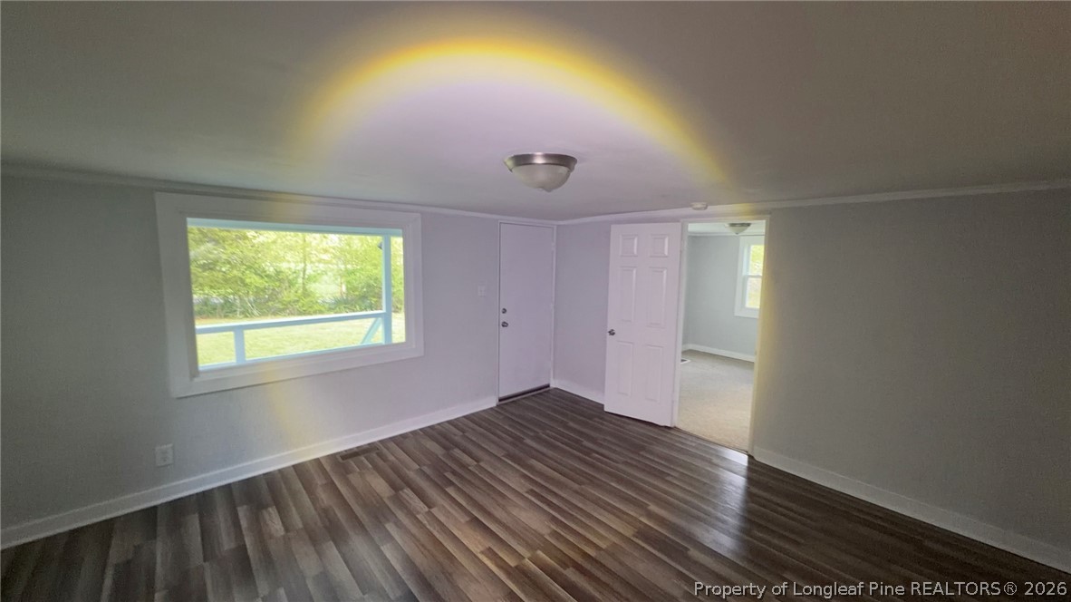 3612 Mt Zion Church Road Mebane, NC 27302 - Photo 13 of 37 an empty room with wooden floor and windows