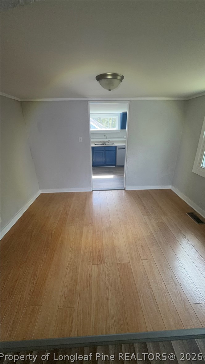 3612 Mt Zion Church Road Mebane, NC 27302 - Photo 15 of 37 an empty room with wooden floor and windows