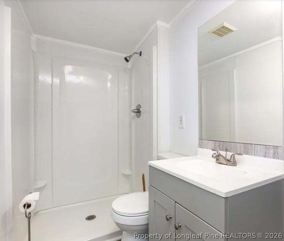 3612 Mt Zion Church Road Mebane, NC 27302 - Photo 24 of 37 a bathroom with a sink toilet and shower