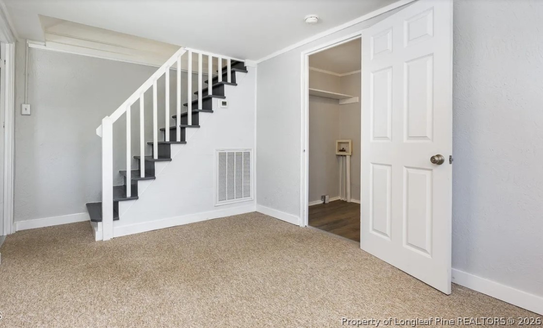 3612 Mt Zion Church Road Mebane, NC 27302 - Photo 27 of 37 a view of a hallway with staircase and white walls