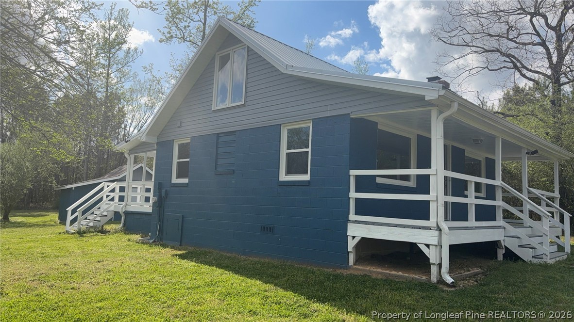 3612 Mt Zion Church Road Mebane, NC 27302 - Photo 3 of 37 a house with wooden fence and porch