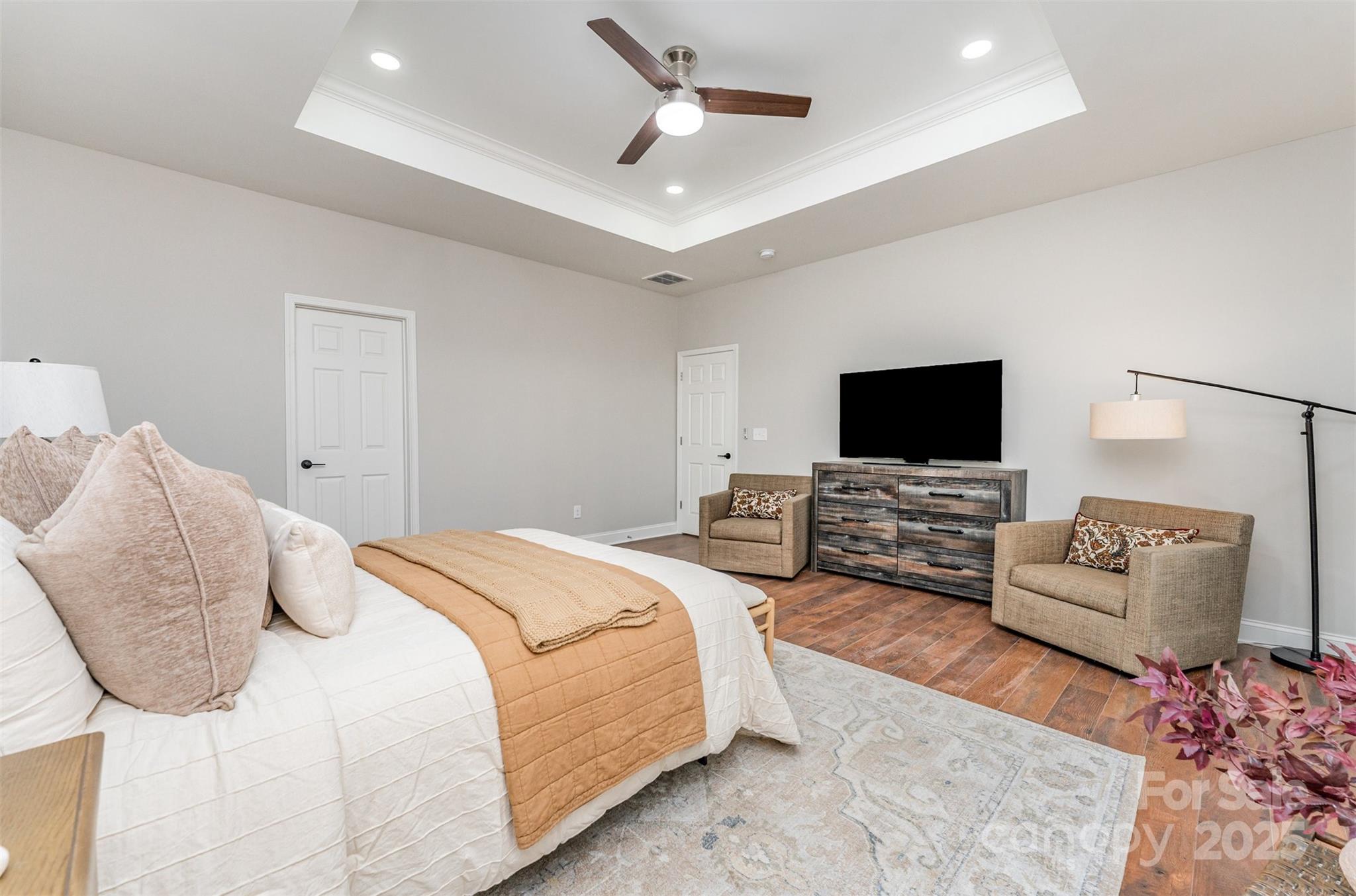 839 Stanley Spencer Mountain Road Gastonia, NC 28056 - Photo 15 of 26 a spacious bedroom with a bed and a flat screen tv