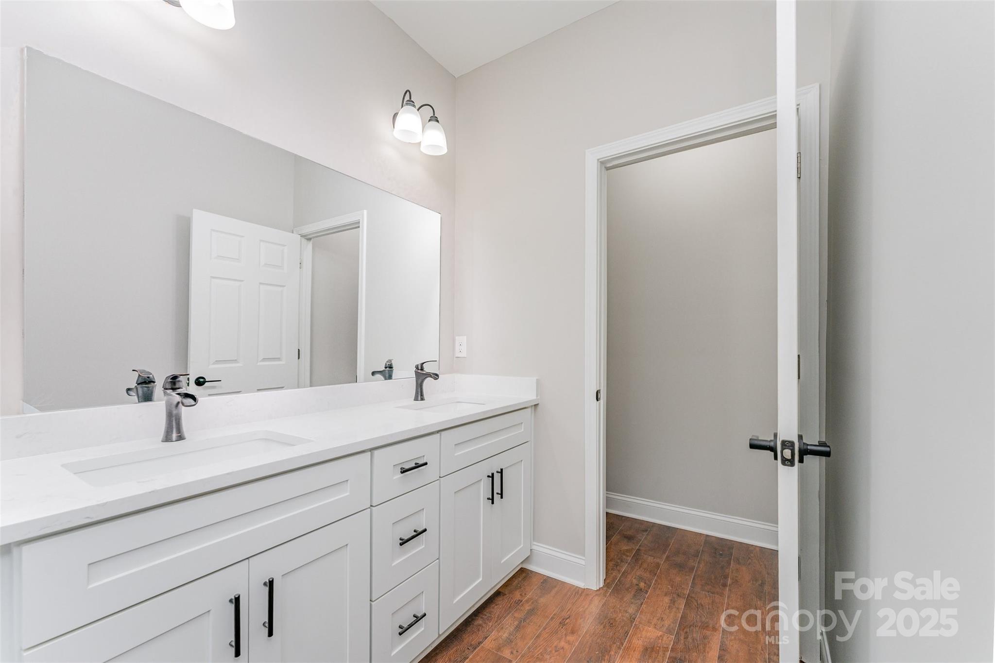 839 Stanley Spencer Mountain Road Gastonia, NC 28056 - Photo 18 of 26 a bathroom with a double vanity sink and mirror