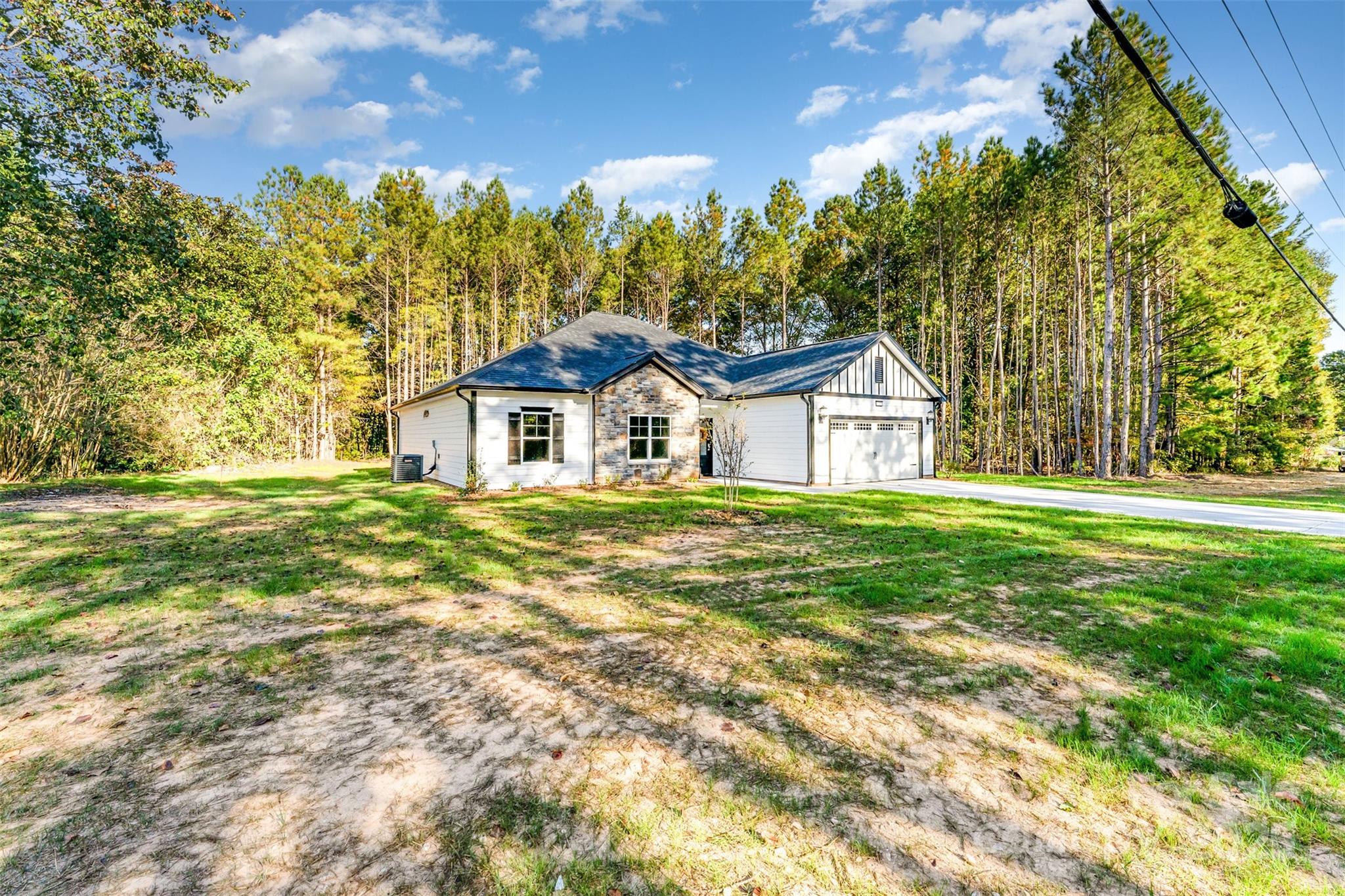 839 Stanley Spencer Mountain Road Gastonia, NC 28056 - Photo 2 of 26 a house view with a garden space