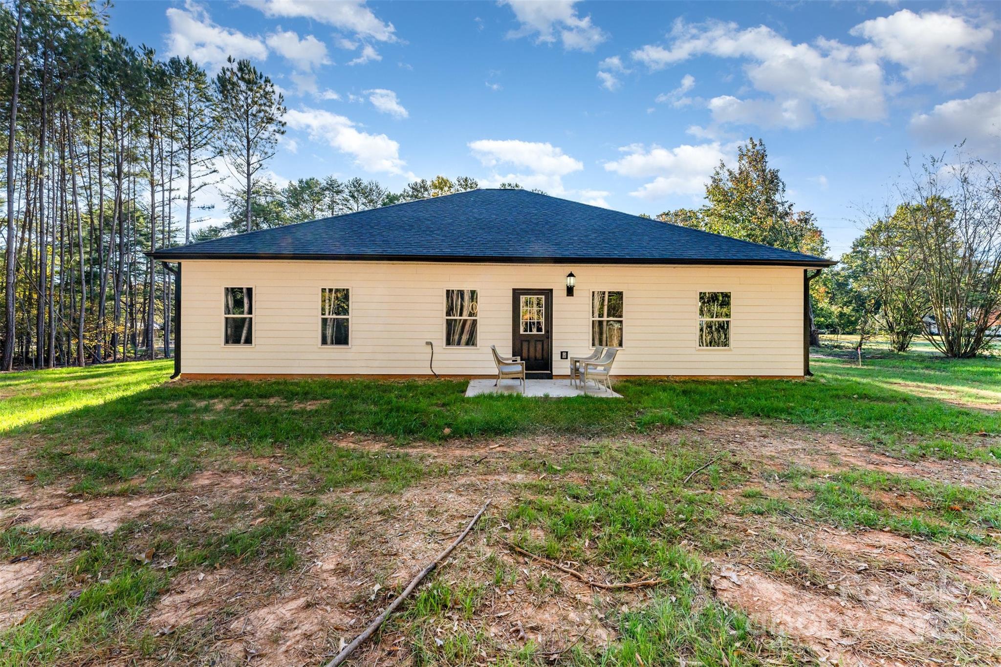 839 Stanley Spencer Mountain Road Gastonia, NC 28056 - Photo 24 of 26 a view of a backyard with large tree