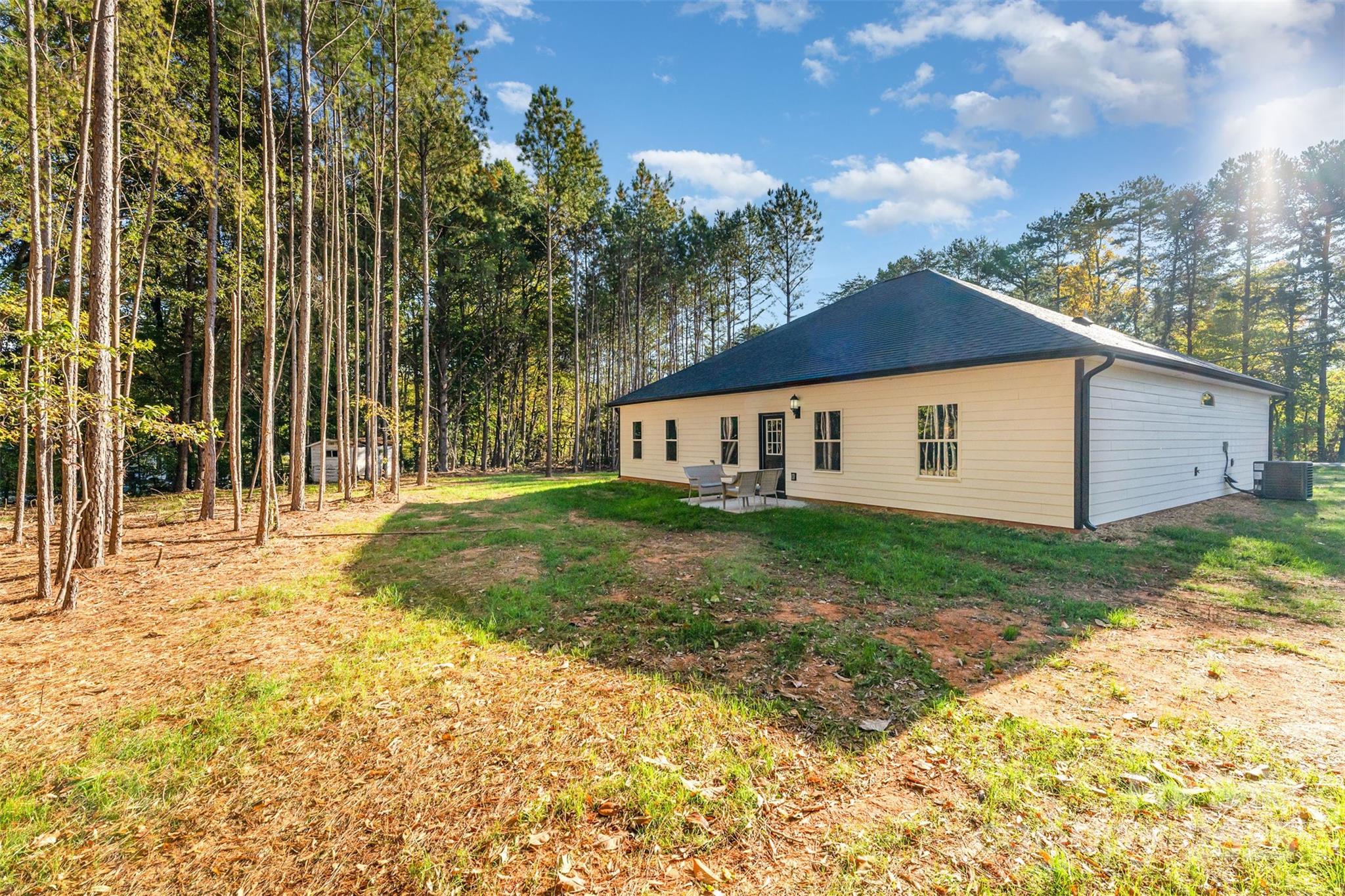 839 Stanley Spencer Mountain Road Gastonia, NC 28056 - Photo 25 of 26 a view of a house with backyard and garden