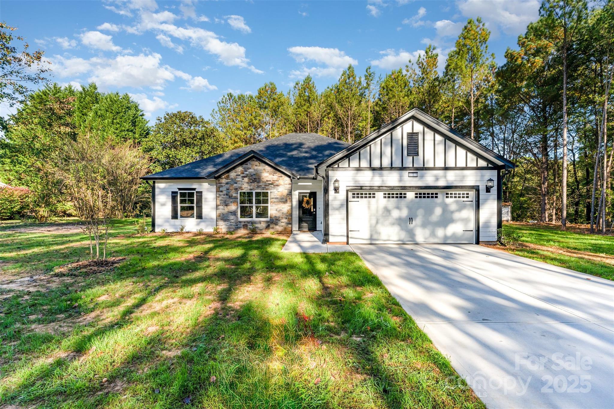 839 Stanley Spencer Mountain Road Gastonia, NC 28056 - Photo 3 of 26 a front view of a house with a yard