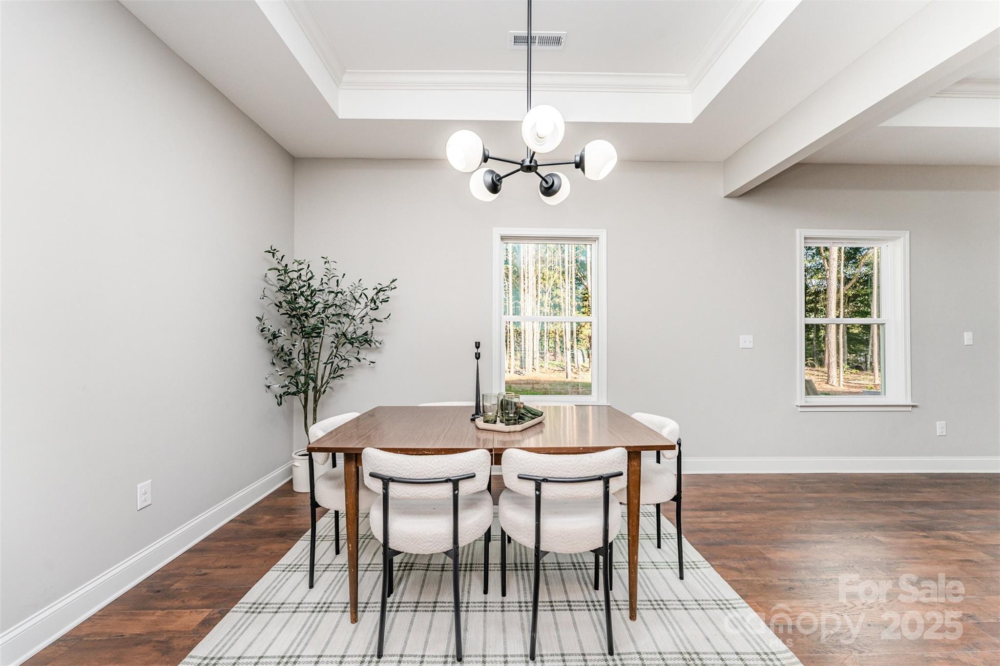 839 Stanley Spencer Mountain Road Gastonia, NC 28056 - Photo 9 of 26 a view of a dining room with furniture and chandelier