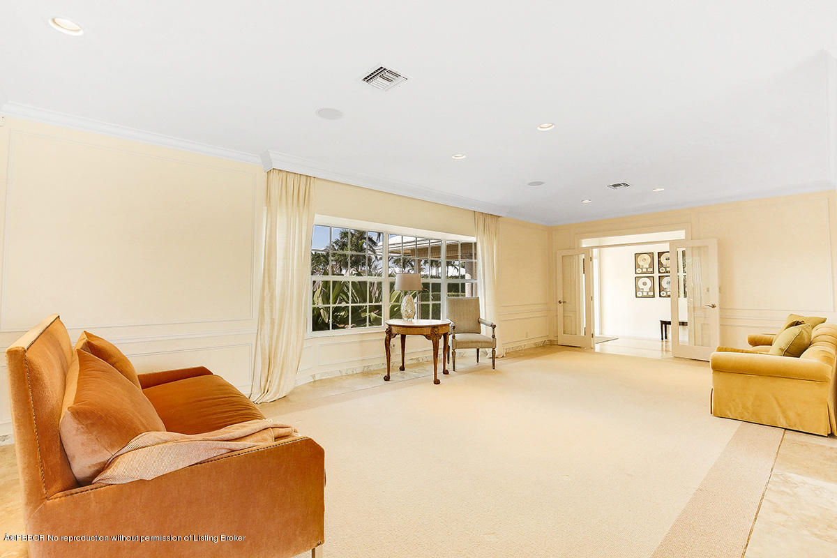 1 Spoonbill Road Manalapan, FL 33462 - Photo 5 of 28 a living room with furniture and a large window